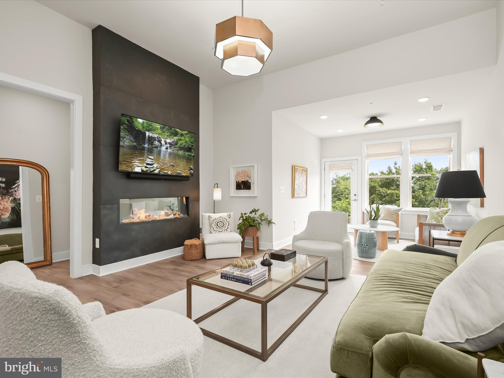 8023 Jennys Way, Unit 9 Fulton, MD 20759 - Photo 5 of 46 a living room with furniture a flat screen tv and a large window
