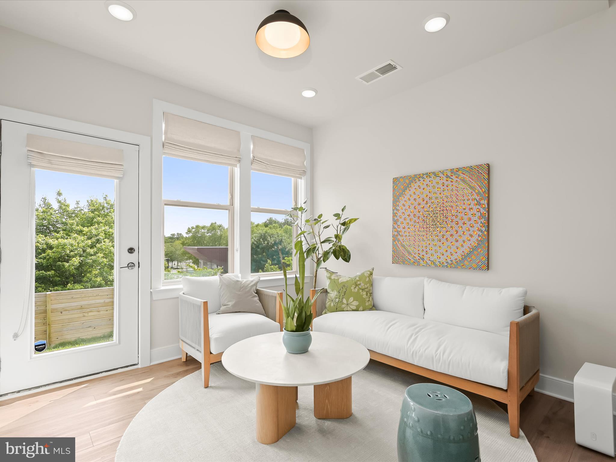 8023 Jennys Way, Unit 9 Fulton, MD 20759 - Photo 8 of 46 a living room with furniture and a potted plant