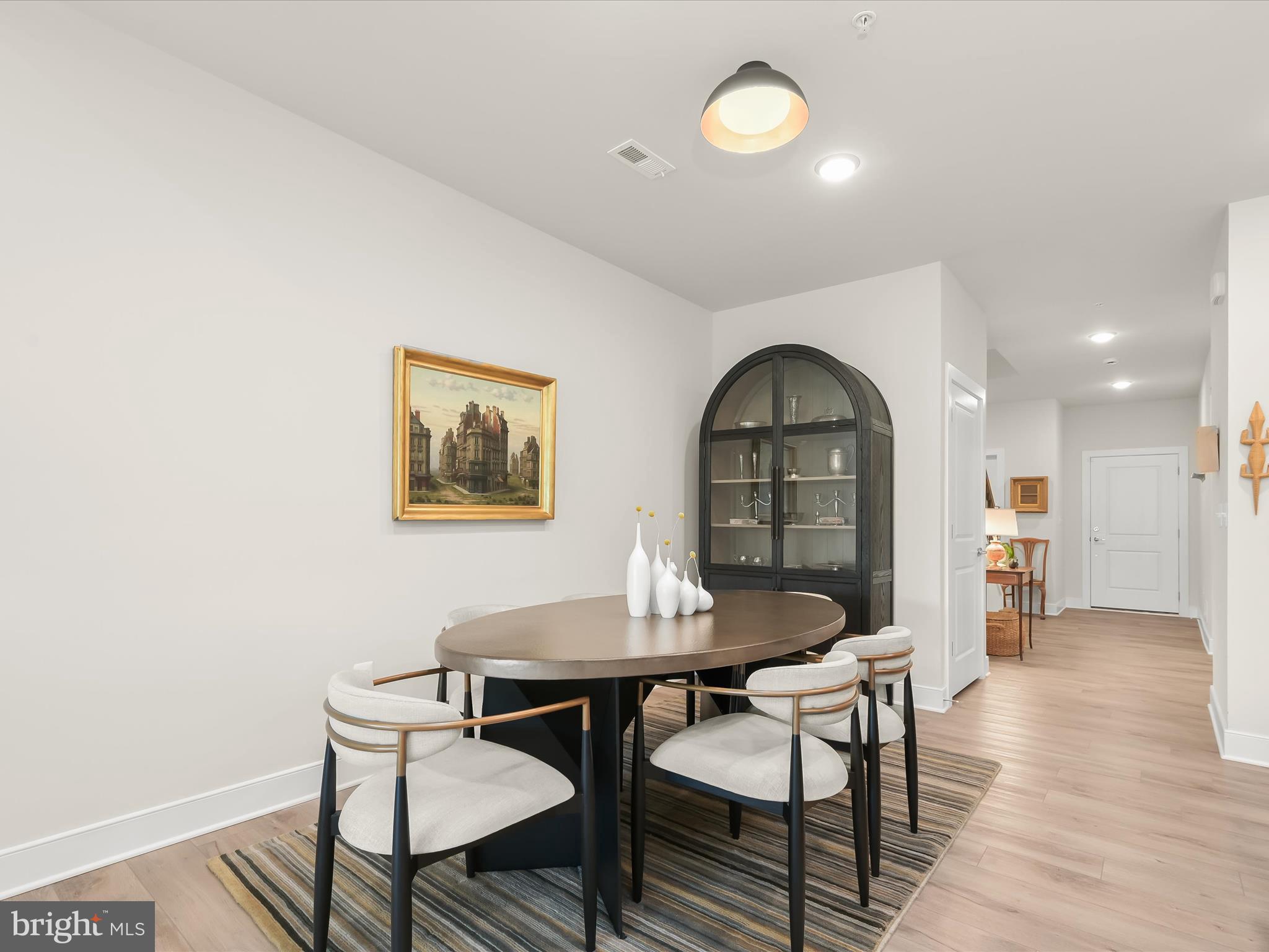 8023 Jennys Way, Unit 9 Fulton, MD 20759 - Photo 10 of 46 a view of a dining room with furniture and wooden floor
