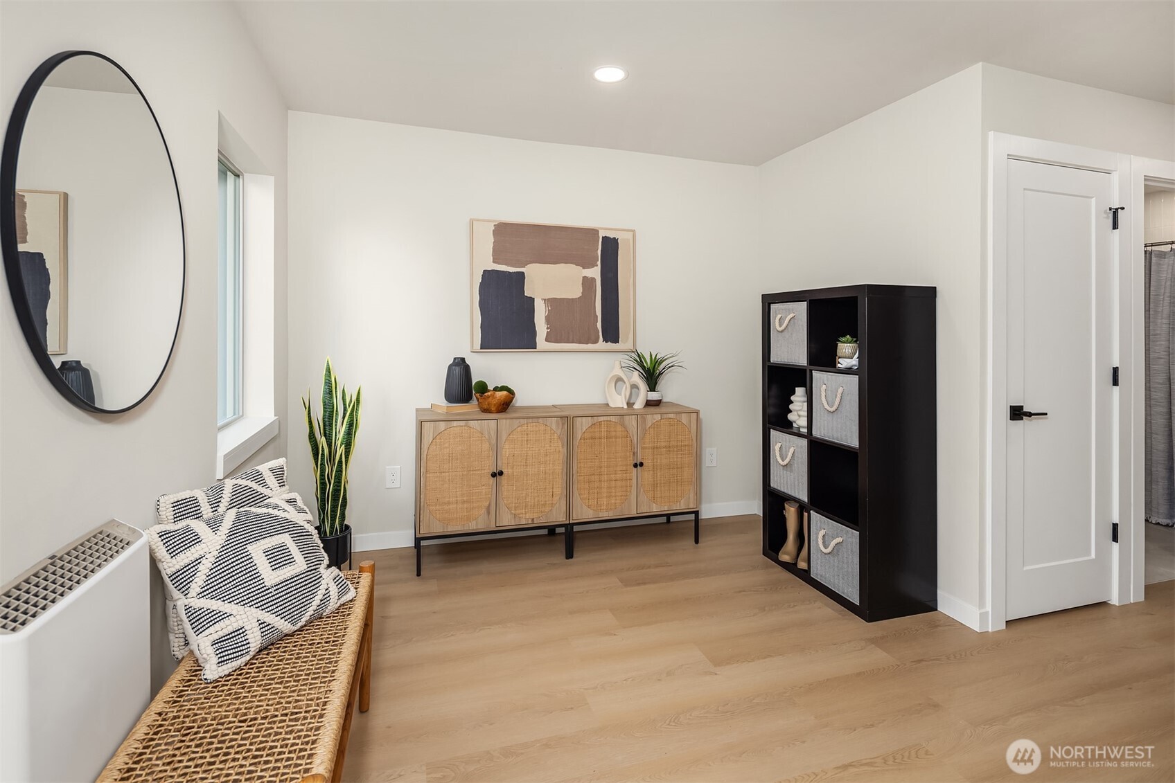 1153 Northwest 58th Street Seattle, WA 98107 - Photo 2 of 29 a bedroom with furniture and a mirror