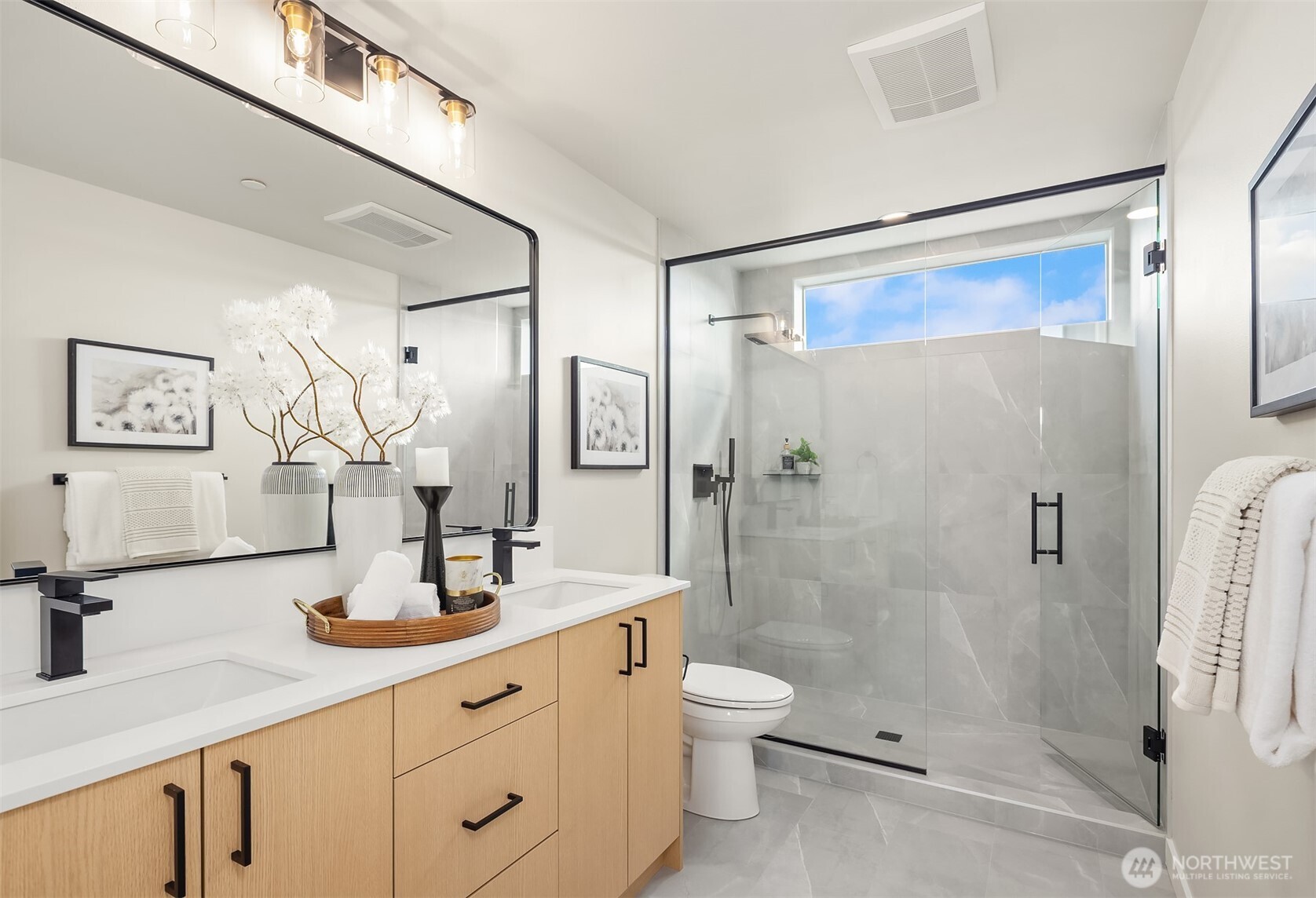 1153 Northwest 58th Street Seattle, WA 98107 - Photo 26 of 29 a bathroom with a shower sink vanity mirror and toilet