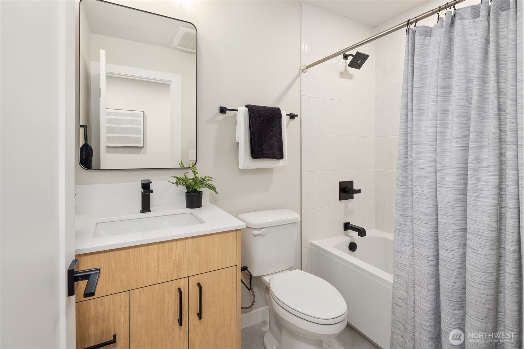 1153 Northwest 58th Street Seattle, WA 98107 - Photo 6 of 29 a bathroom with a sink a toilet and shower