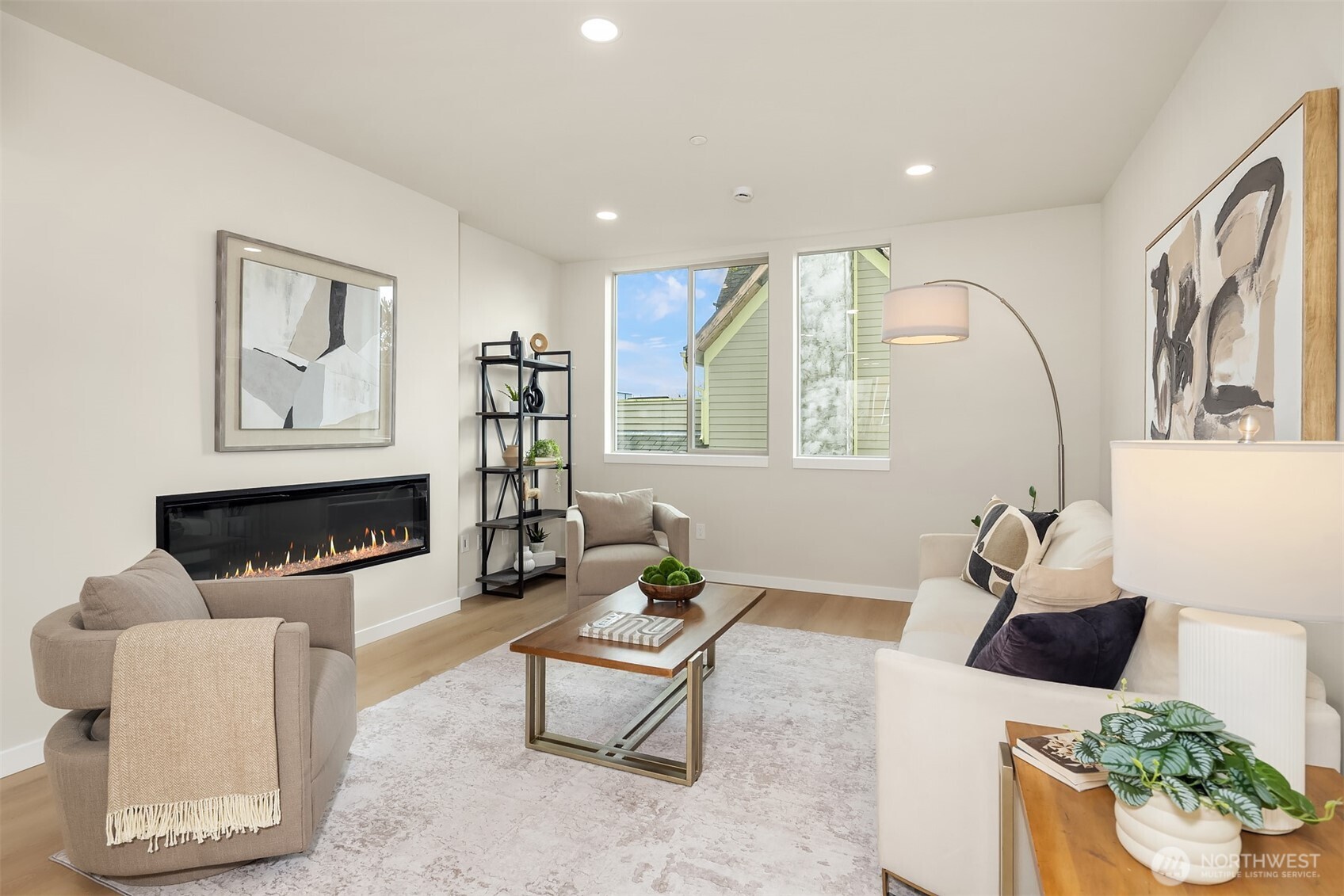 1153 Northwest 58th Street Seattle, WA 98107 - Photo 8 of 29 a living room with furniture a rug and a fireplace
