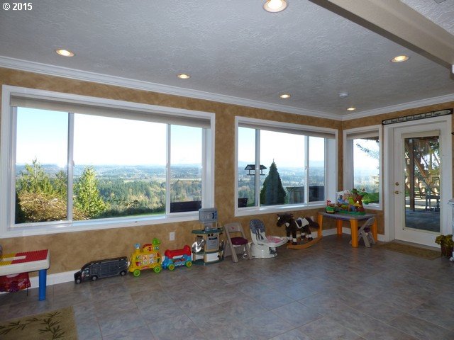 20586 South Springwater Road Estacada, OR 97023 - Photo 32 of 32 a living room with furniture toys and large windows