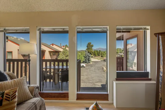 a view of front door and porch with furniture