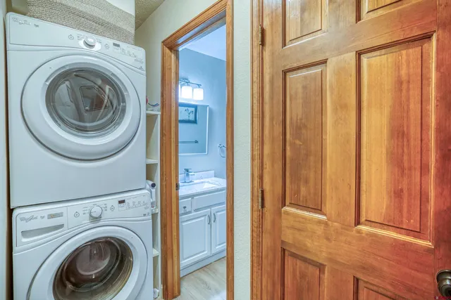a view of a hallway with washer and dryer
