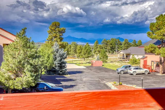 a view of a swimming pool with an outdoor seating