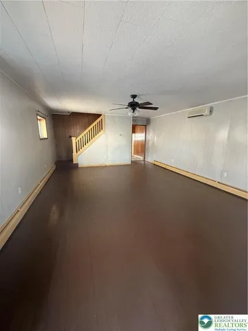 a view of an empty room and a window