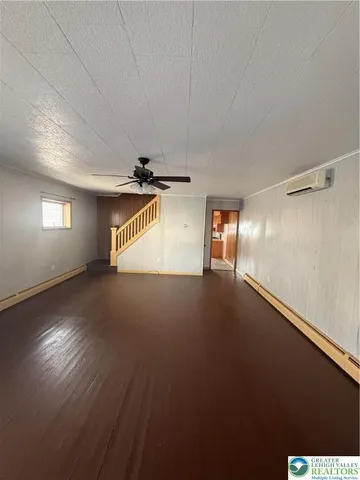 a view of an empty room with windows