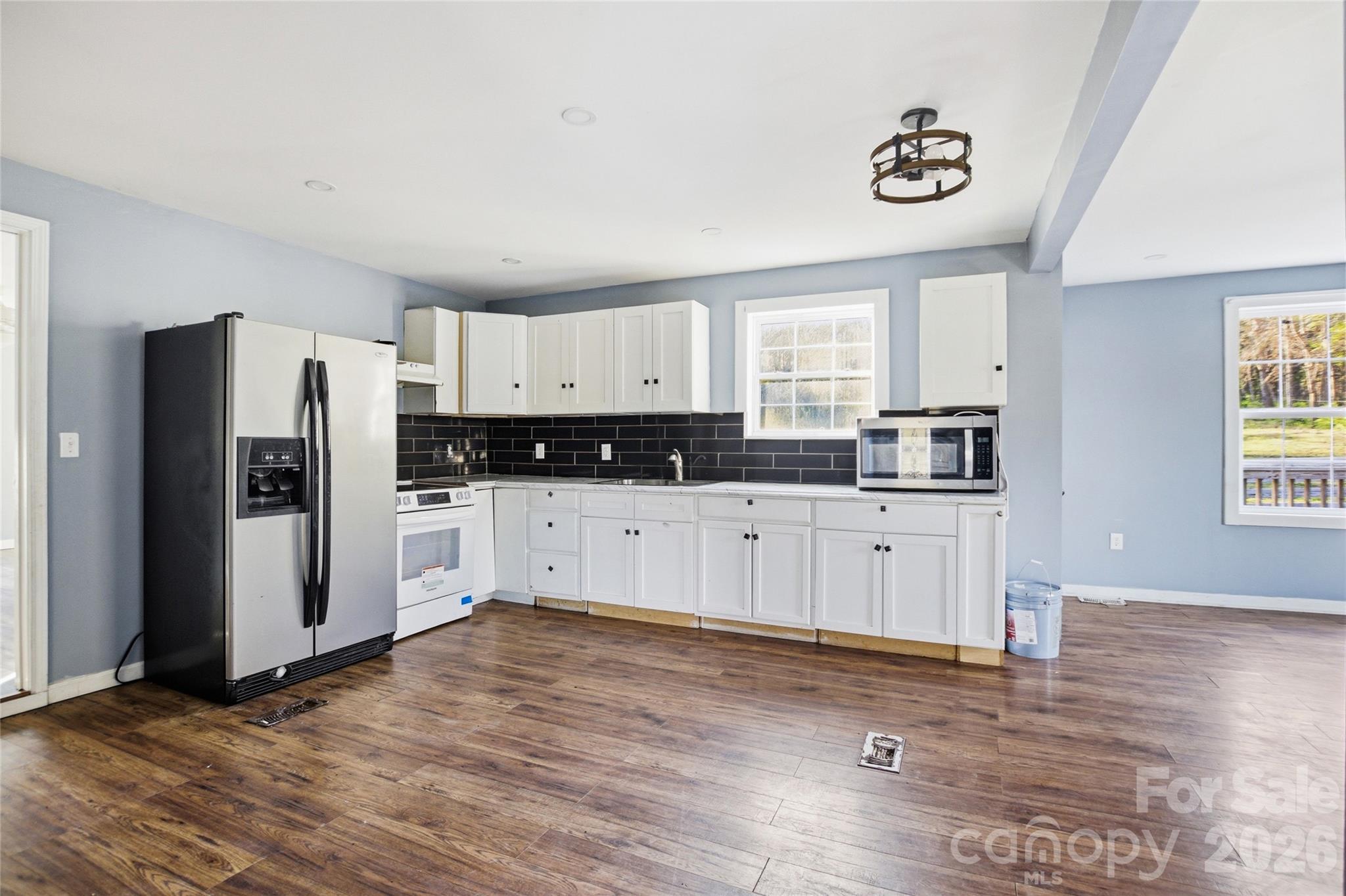1022 Pine Ridge Road Chester, SC 29706 - Photo 4 of 13 a kitchen with stainless steel appliances a refrigerator sink and cabinets