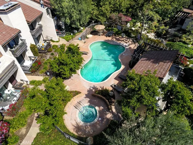 an aerial view of a house with a yard and outdoor seating