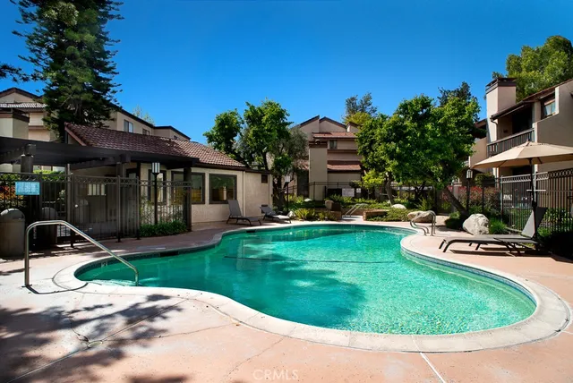 a view of a house with backyard porch and sitting area