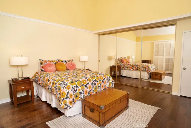 a bedroom with a bed window and a lamp