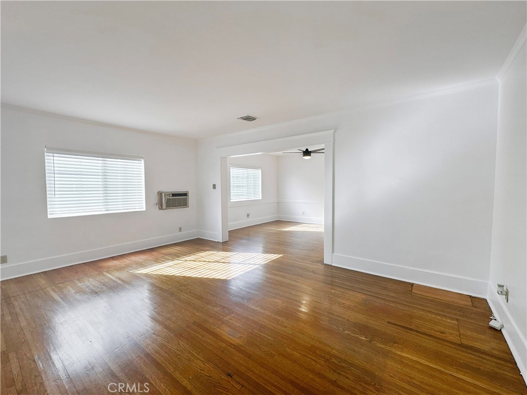 209 Elm Street Alhambra, CA 91801 - Photo 4 of 17 a view of empty room with wooden floor and fan