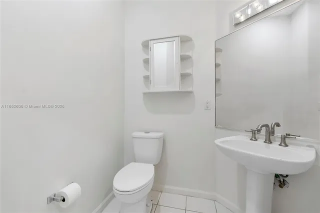 a kitchen with a sink stove and microwave