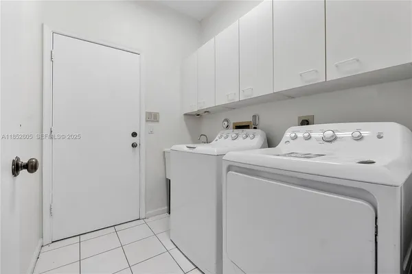 a kitchen with a sink stove and microwave