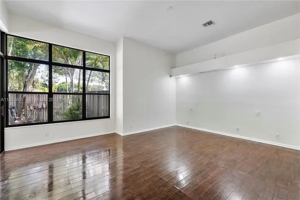 an empty room with wooden floor