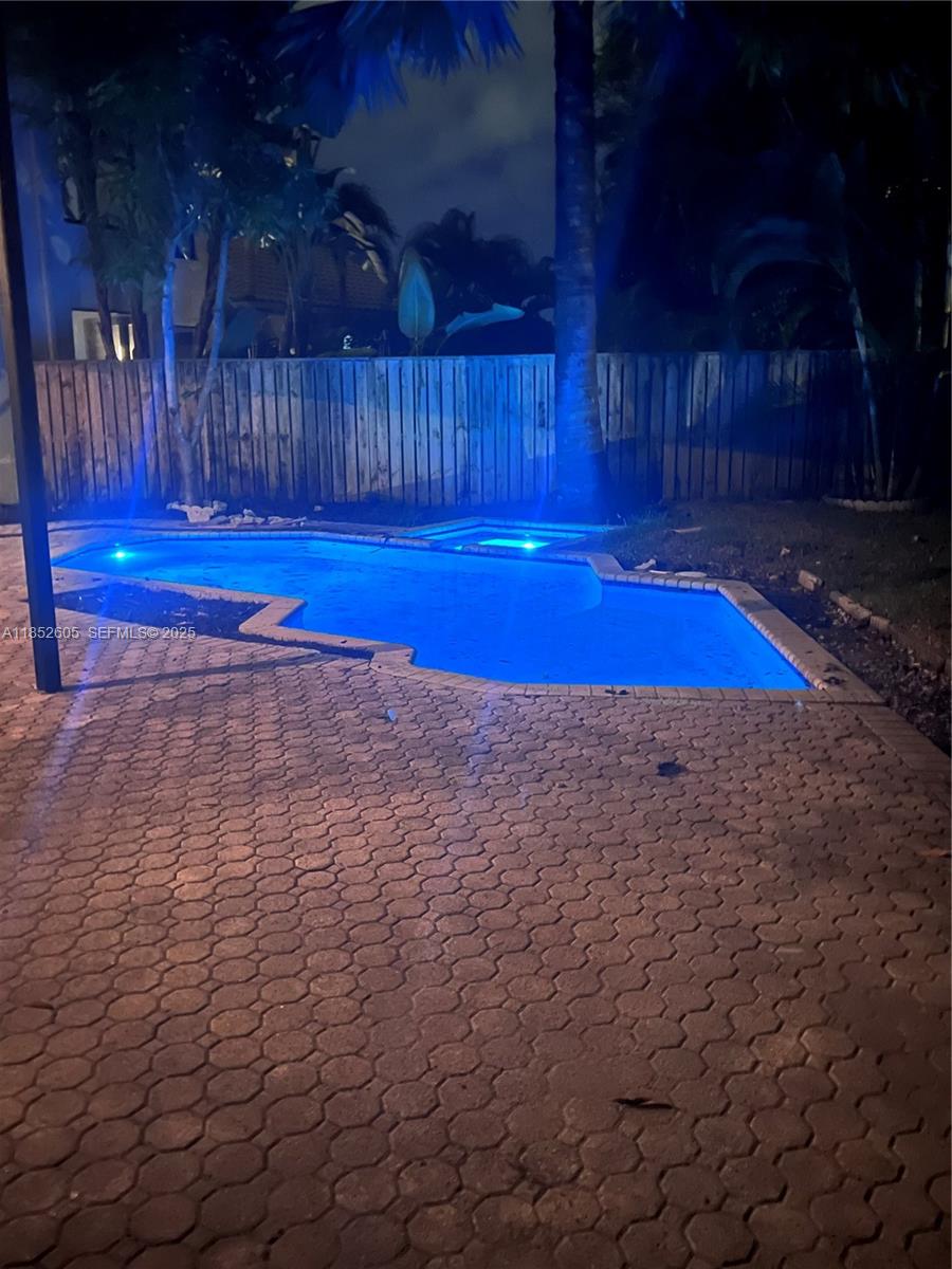 2449 Northwest 64th Street Boca Raton, FL 33496 - Photo 38 of 50 a view of backyard with wooden floor