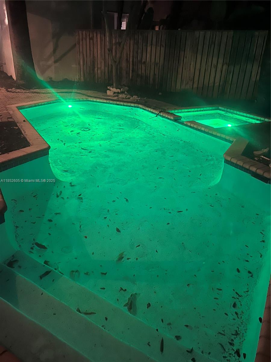 2449 Northwest 64th Street Boca Raton, FL 33496 - Photo 39 of 50 a backyard of a house with lots of green space