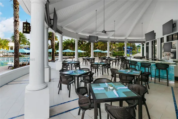 a very nice looking dining room with many windows