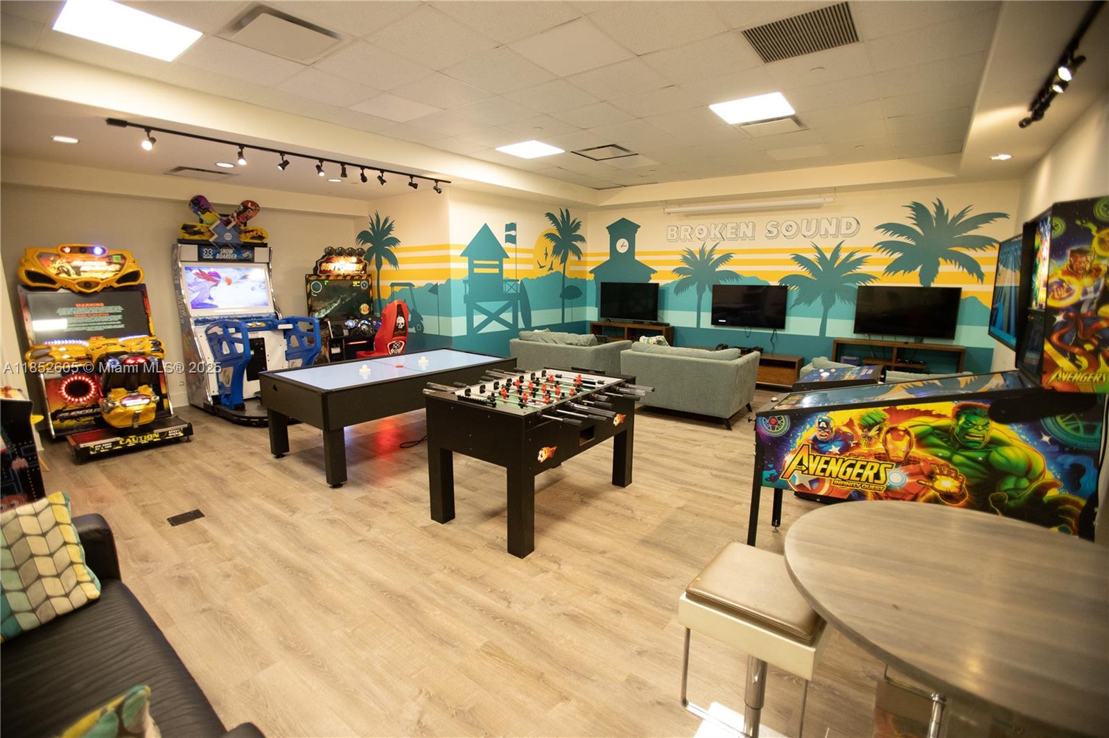 2449 Northwest 64th Street Boca Raton, FL 33496 - Photo 49 of 50 a bedroom with furniture and a flat screen tv