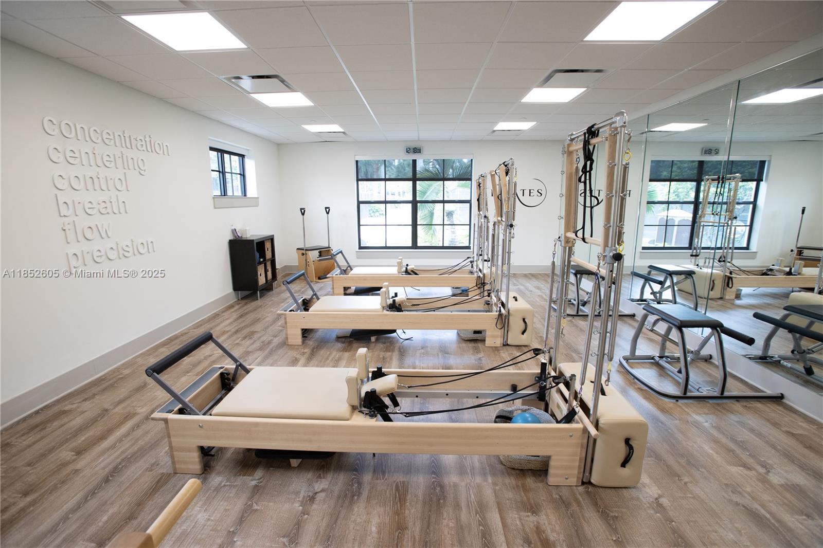 2449 Northwest 64th Street Boca Raton, FL 33496 - Photo 50 of 50 a living room with patio furniture and a wooden floor