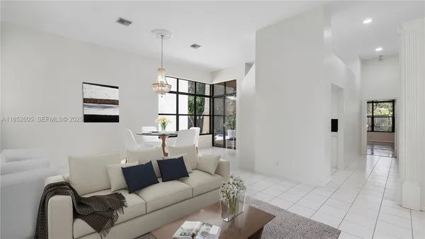 a view of a livingroom with furniture and an window