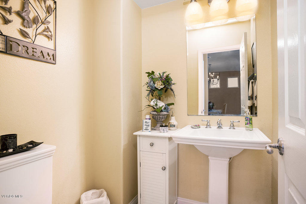13709 Swift Run Street Moorpark, CA 93021 - Photo 15 of 34 a bathroom with a sink and a mirror