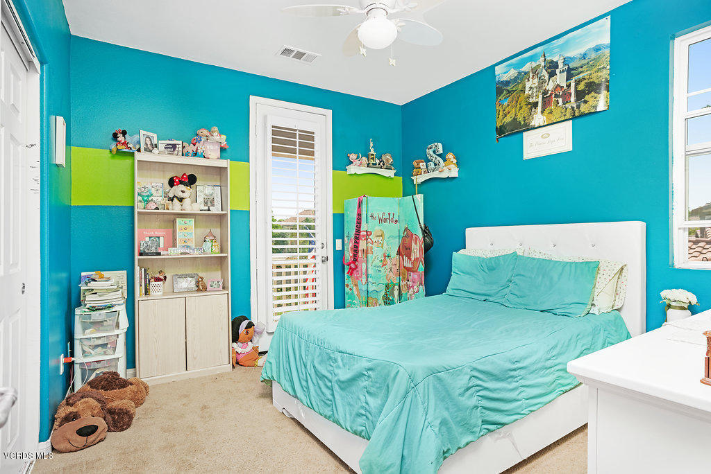 13709 Swift Run Street Moorpark, CA 93021 - Photo 23 of 34 a bedroom with a bed and a window