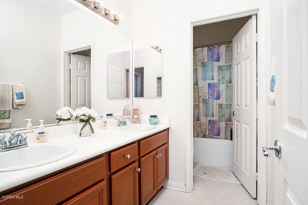 13709 Swift Run Street Moorpark, CA 93021 - Photo 24 of 34 a bathroom with a sink and a mirror