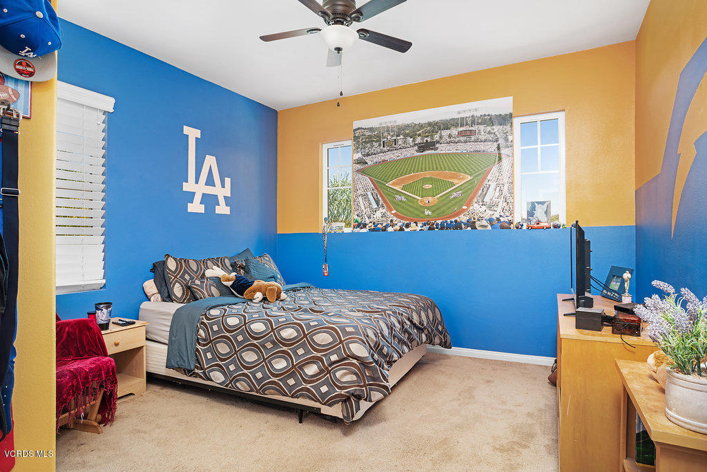 13709 Swift Run Street Moorpark, CA 93021 - Photo 27 of 34 a bedroom with a bed and a dresser in it