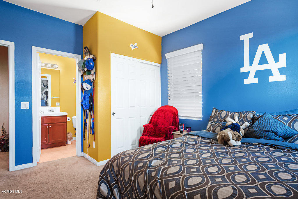 13709 Swift Run Street Moorpark, CA 93021 - Photo 28 of 34 a bedroom with a bed and a closet