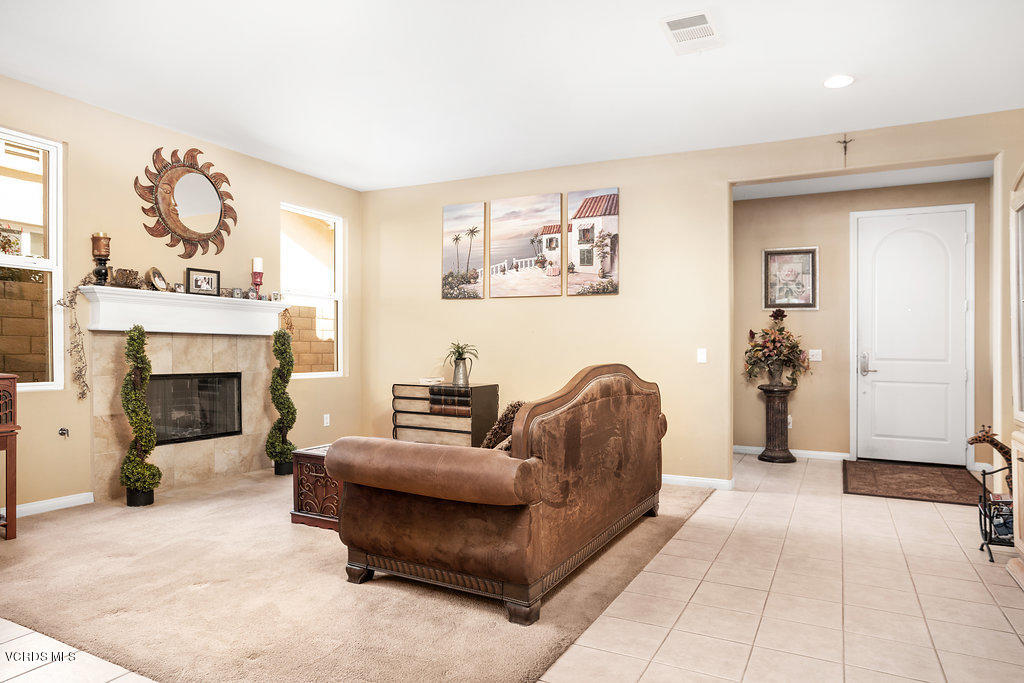 13709 Swift Run Street Moorpark, CA 93021 - Photo 5 of 34 a living room with furniture and a fireplace