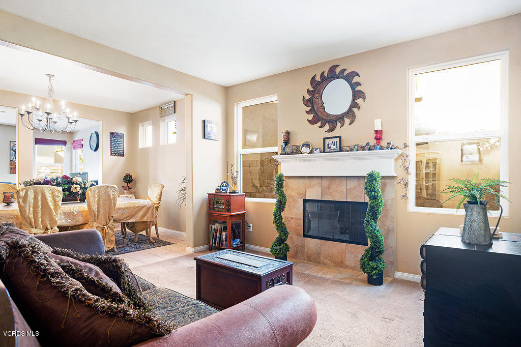13709 Swift Run Street Moorpark, CA 93021 - Photo 6 of 34 a living room with furniture and a fireplace