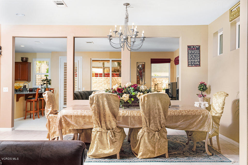 13709 Swift Run Street Moorpark, CA 93021 - Photo 7 of 34 a view of a dining room with furniture and chandelier