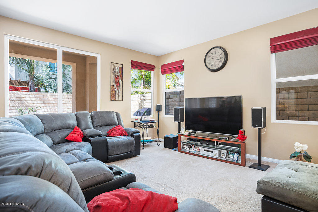 13709 Swift Run Street Moorpark, CA 93021 - Photo 9 of 34 a living room with furniture and a flat screen tv