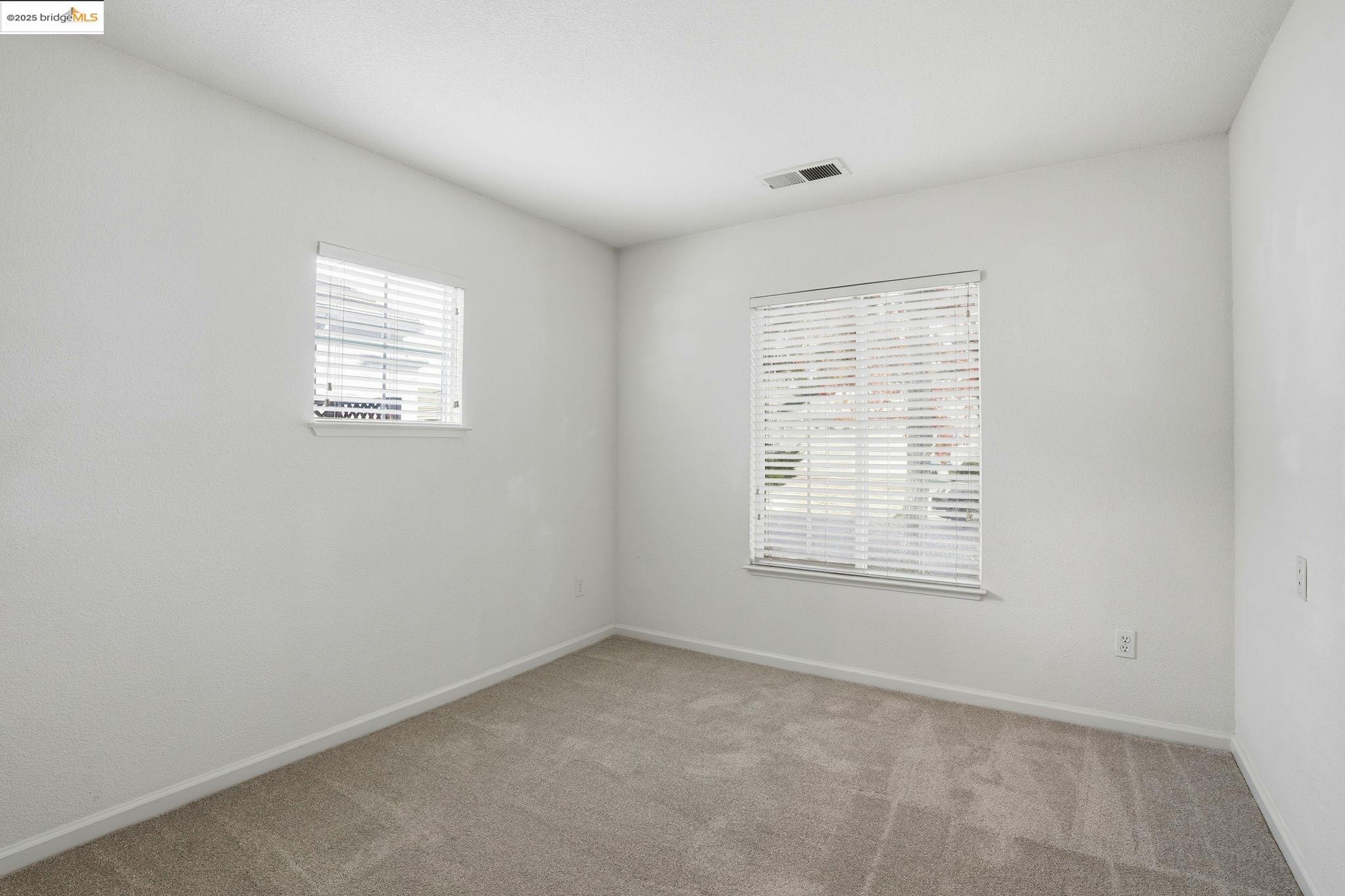 385 Ruby Terrace Brentwood, CA 94513 - Photo 18 of 37 an empty room with a window