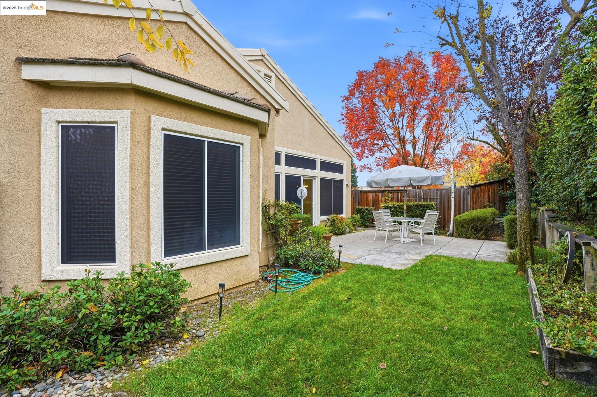 385 Ruby Terrace Brentwood, CA 94513 - Photo 24 of 37 a view of house with backyard and sitting area