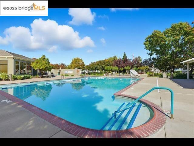 385 Ruby Terrace Brentwood, CA 94513 - Photo 32 of 37 a view of a swimming pool with a yard