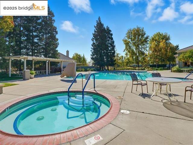 385 Ruby Terrace Brentwood, CA 94513 - Photo 33 of 37 a view of a swimming pool with a lounge chair