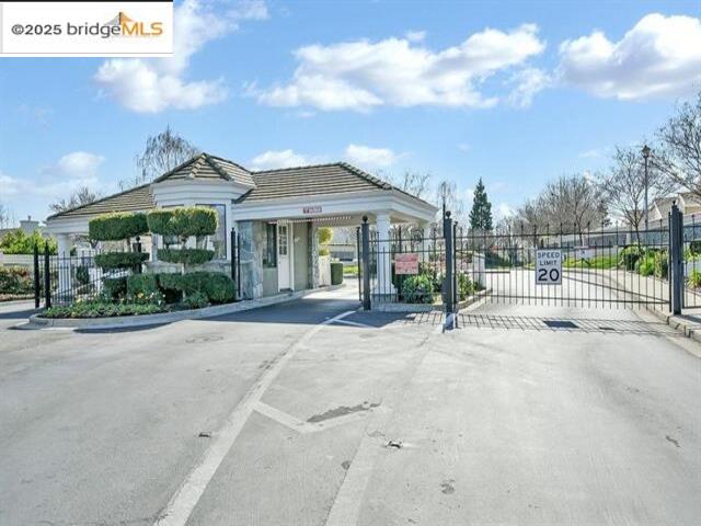 385 Ruby Terrace Brentwood, CA 94513 - Photo 36 of 37 a view of a white house with a yard and potted plants