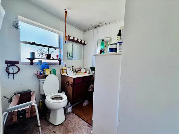 a room with a white couch and a window
