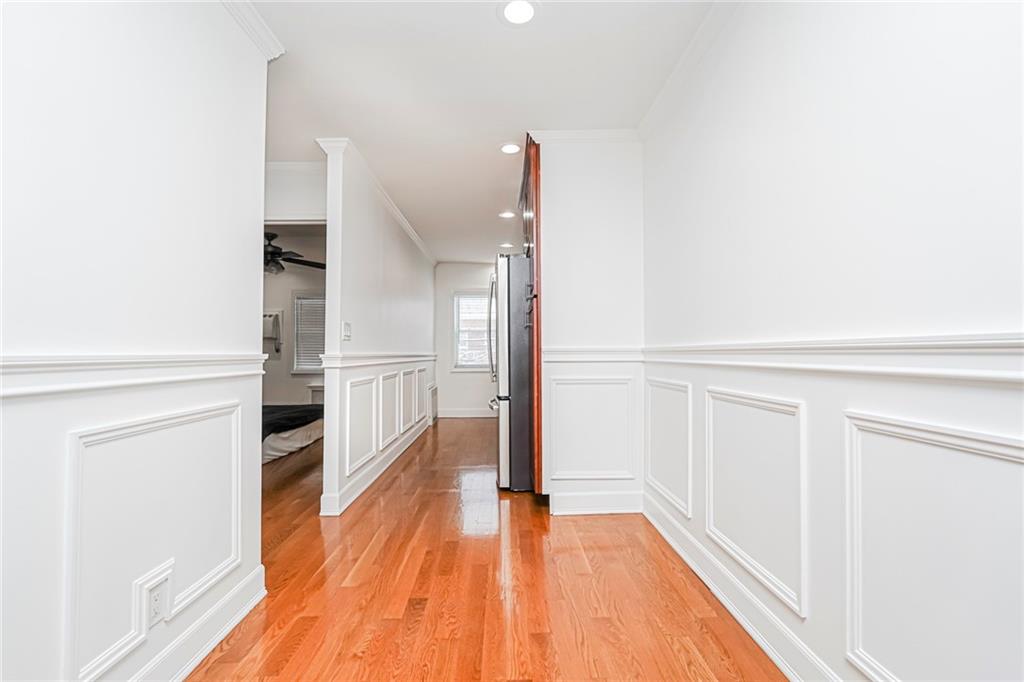 248 Bay 19th Street, Unit B Brooklyn, NY 11214 - Photo 7 of 14 a view of a hallway with wooden floor and staircase