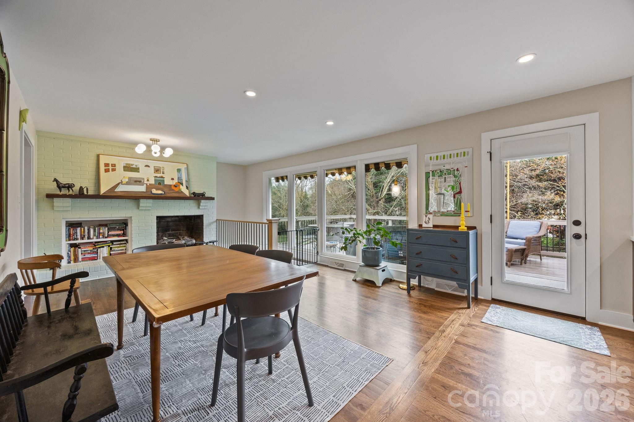 1141 Doby Court Fort Mill, SC 29715 - Photo 12 of 48 a view of a dining room with furniture window and wooden floor