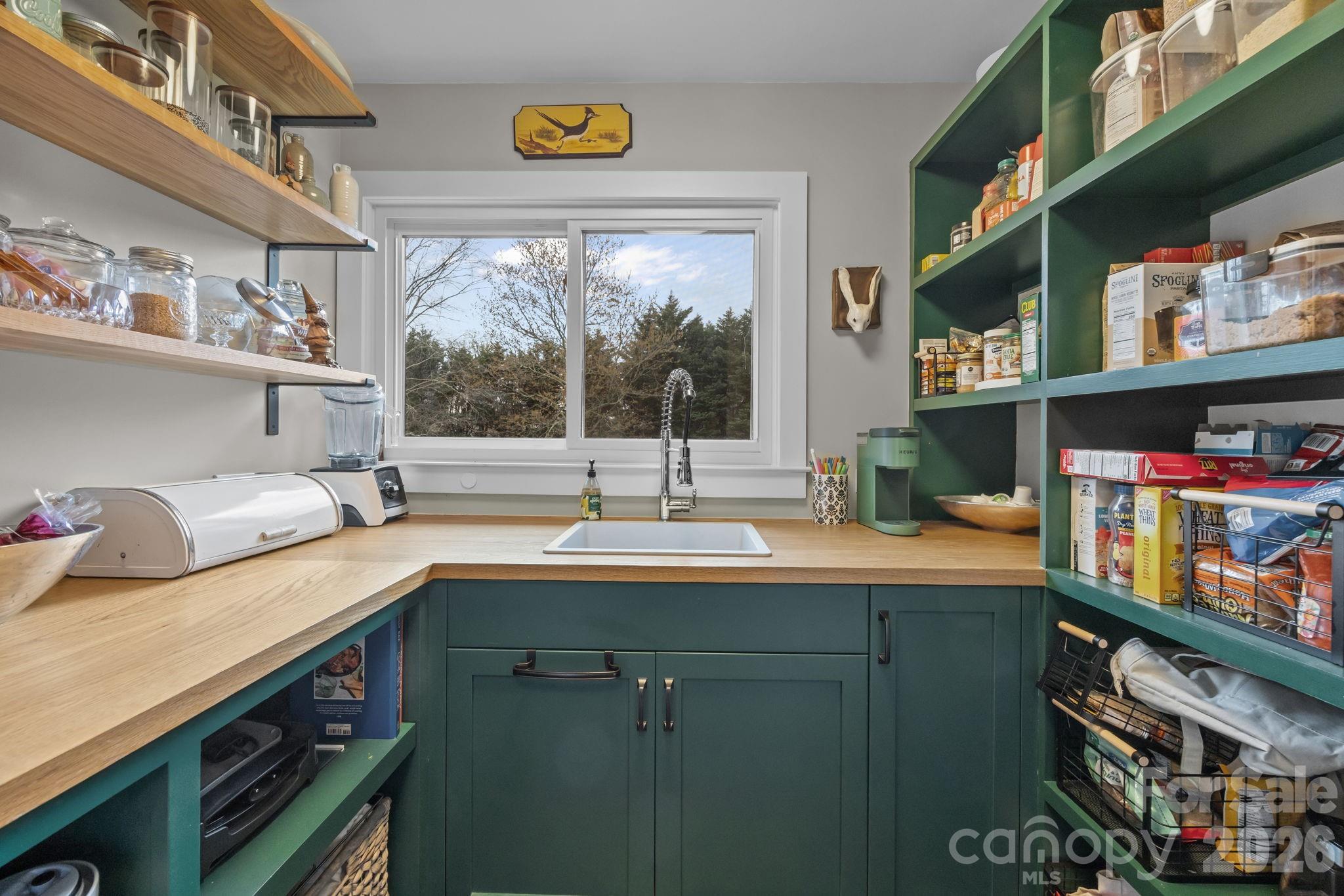 1141 Doby Court Fort Mill, SC 29715 - Photo 17 of 48 a kitchen with stainless steel appliances a sink and a window