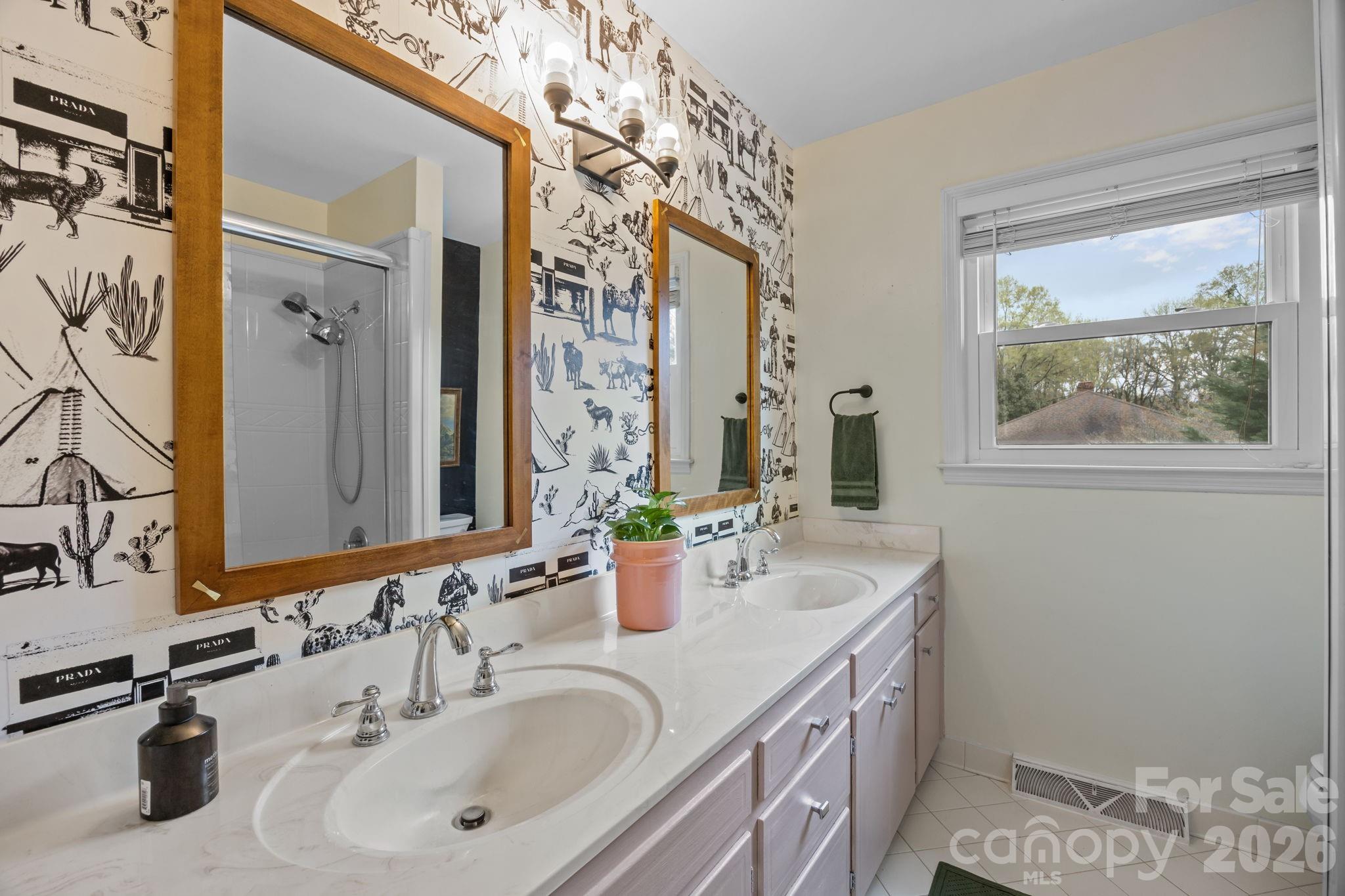 1141 Doby Court Fort Mill, SC 29715 - Photo 24 of 48 a bathroom with double vanity sink and a window