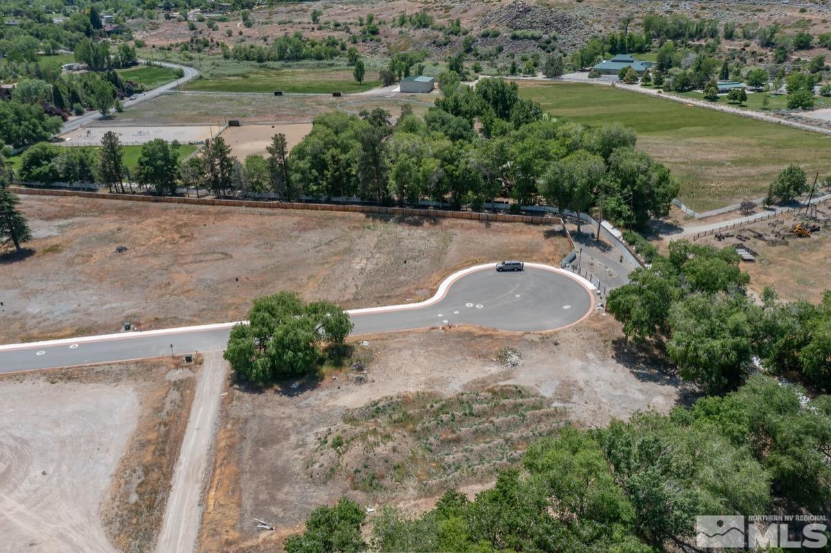 6345 Falabella Way, Unit 5 Reno, NV 89511 - Photo 12 of 26 an aerial view of a house with a yard and lake view