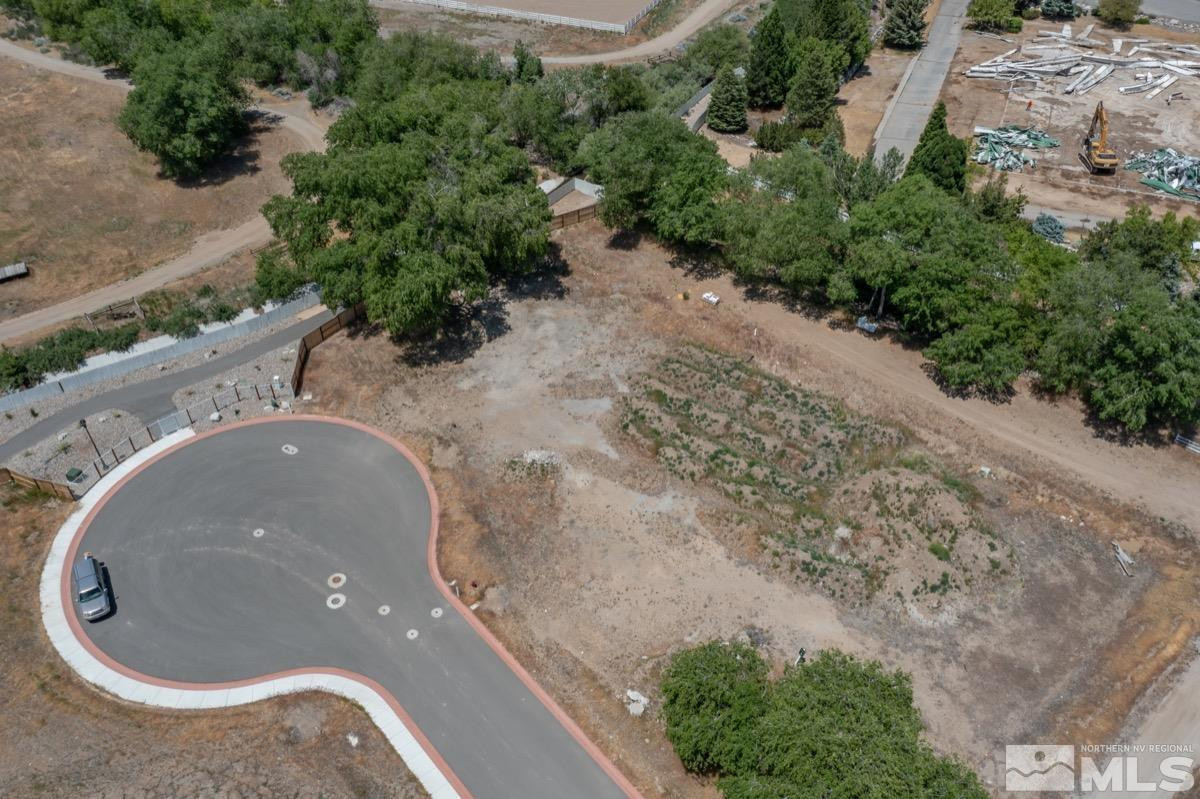6345 Falabella Way, Unit 5 Reno, NV 89511 - Photo 10 of 26 an aerial view of a house with a yard and trees all around