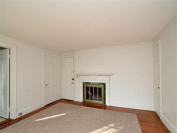 184 Dean Road Brookline, MA 02445 - Photo 7 of 13 a view of an empty room with wooden floor and a window