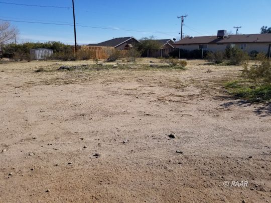 Mayo 081-184-28 Ridgecrest, CA 93555 - Photo 9 of 10 a view of a dry yard with wooden fence